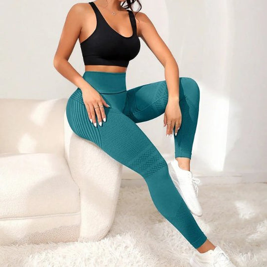 legging sport femme performance plus emeraude femme assise